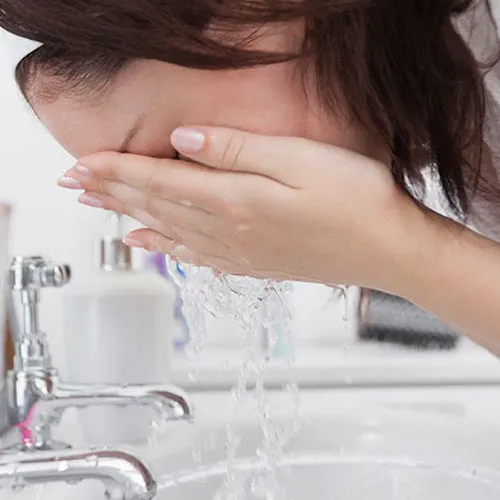 woman washing face