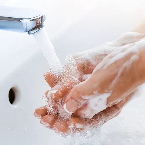 person washing hands