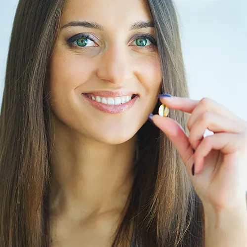 woman holding supplement