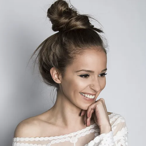 "High bun hairstyle"