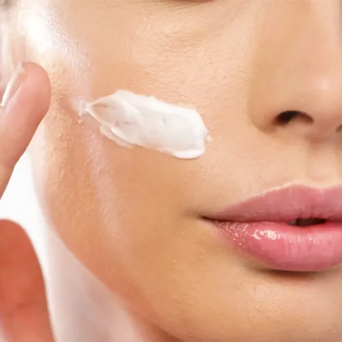 woman applying cream