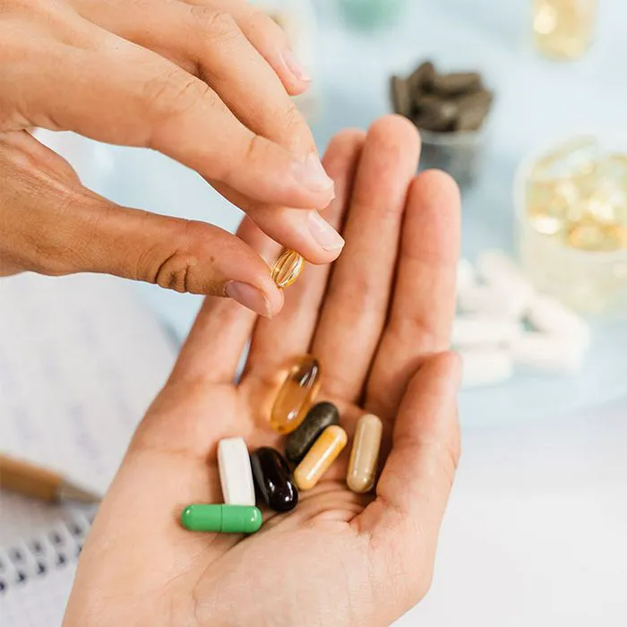 woman-picking-up-vitamins
