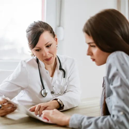 woman talking to doctor