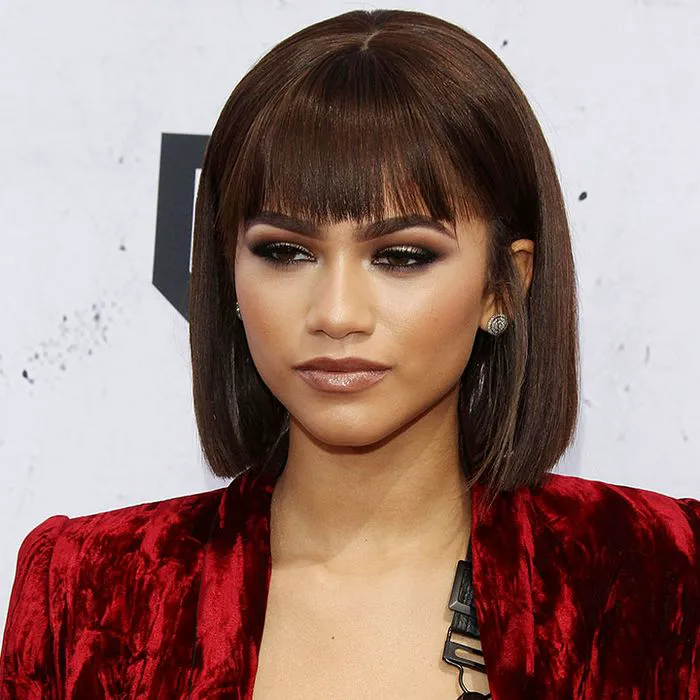 zendaya brown hair full bangs sleek bob red dress red carpet