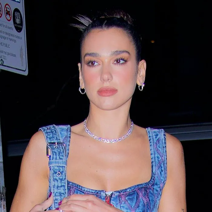 "Dua Lipa in a denim bustier dress"