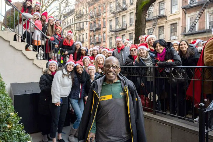Al Roker with carolers