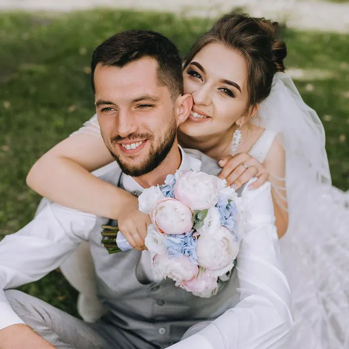 Young happy couple celebrating their wedding day joyfully.