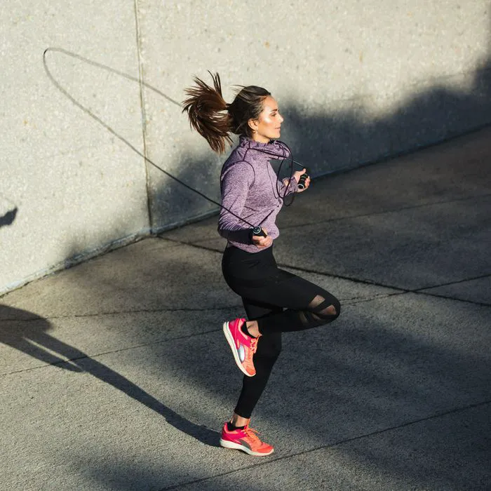 woman jumping rope outside