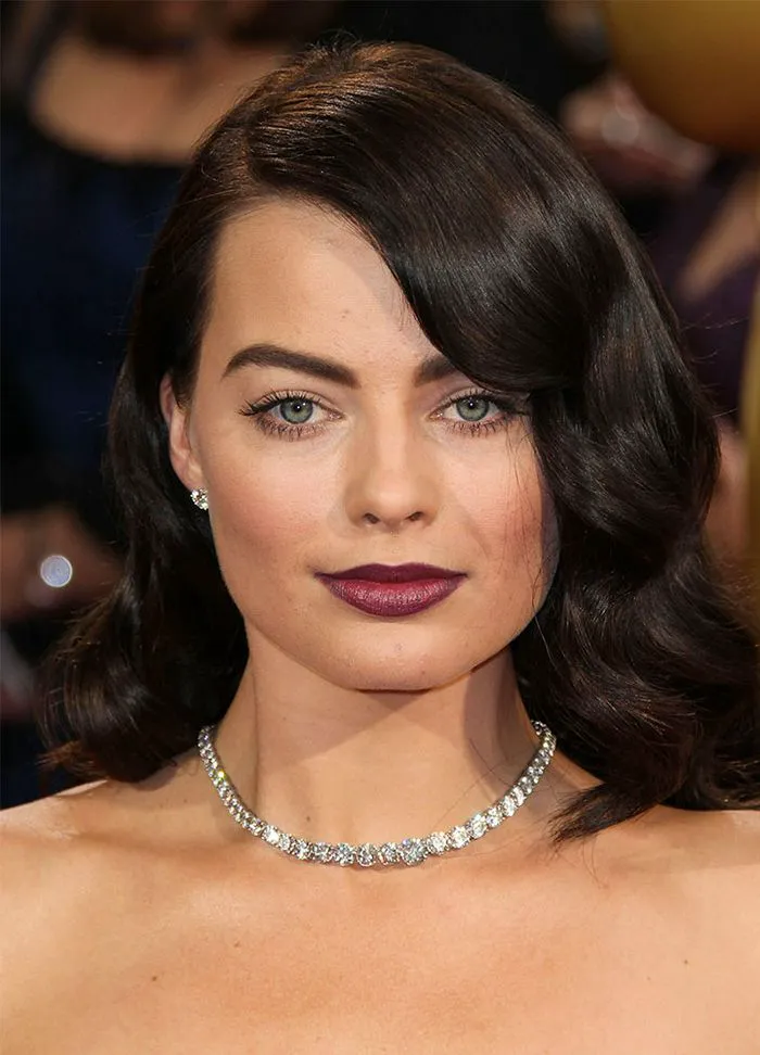 margot robbie dark brunette hair waves side-part dark lipstick academy awards