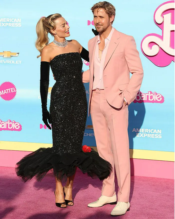 margot robbie black gown long-sleeves ryan gosling pink suit red carpet
