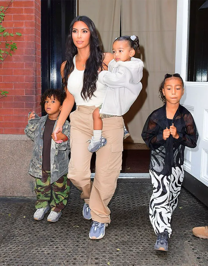 "Kim Kardashian with her children North, Saint, and Chicago"