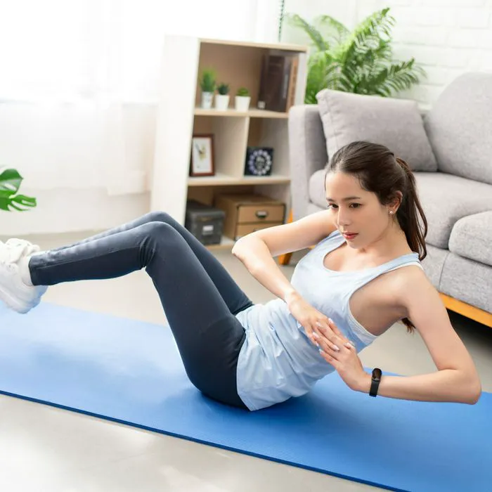 woman performing russian twists