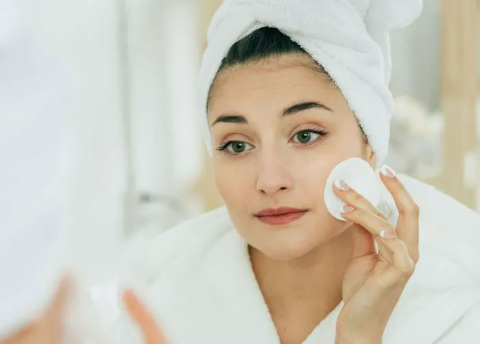 woman-using-makeup-remover
