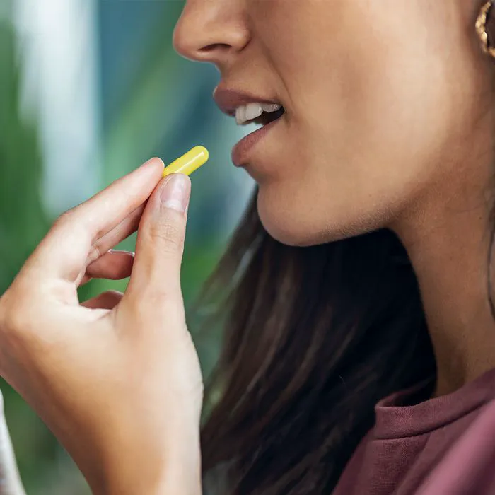 woman-taking-vitamin