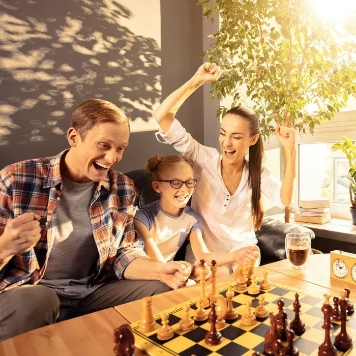 family playing chess