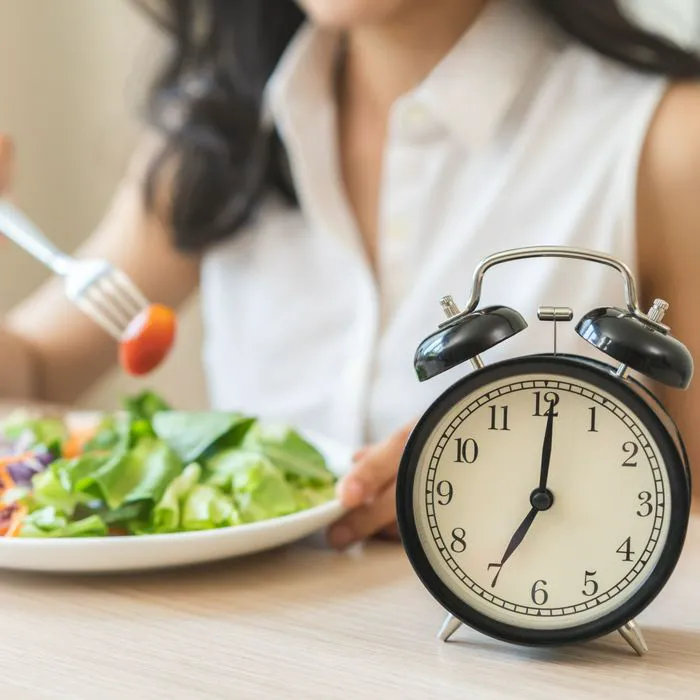woman eating at a certain time