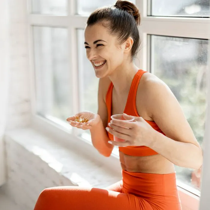 woman taking supplement