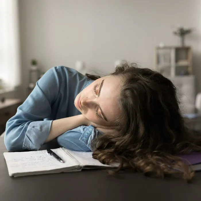 fatigued woman at desk