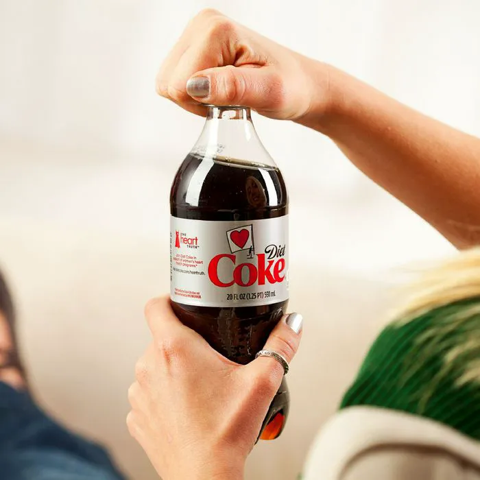 hand opening diet coke bottle