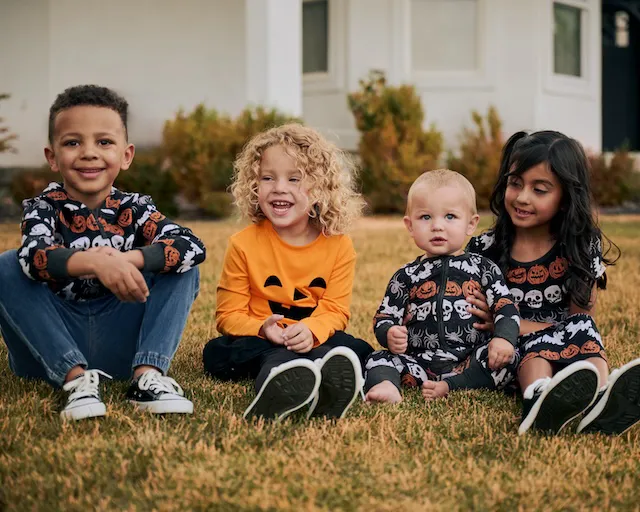 "Halloween lifestyle shot featuring children in costumes"