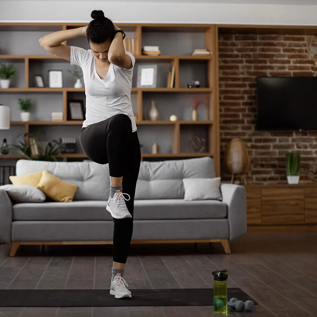 Woman performing crunches for abdominal workout.