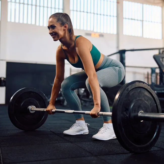"Woman working out with dumbbells"