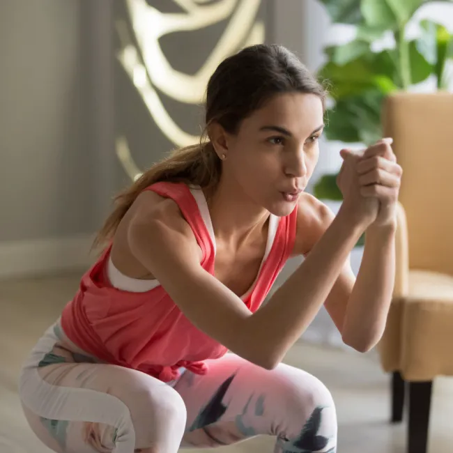 "Woman using dumbbells for strength training"