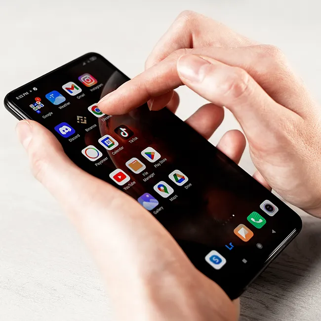 Person using an Android phone, highlighting its features.