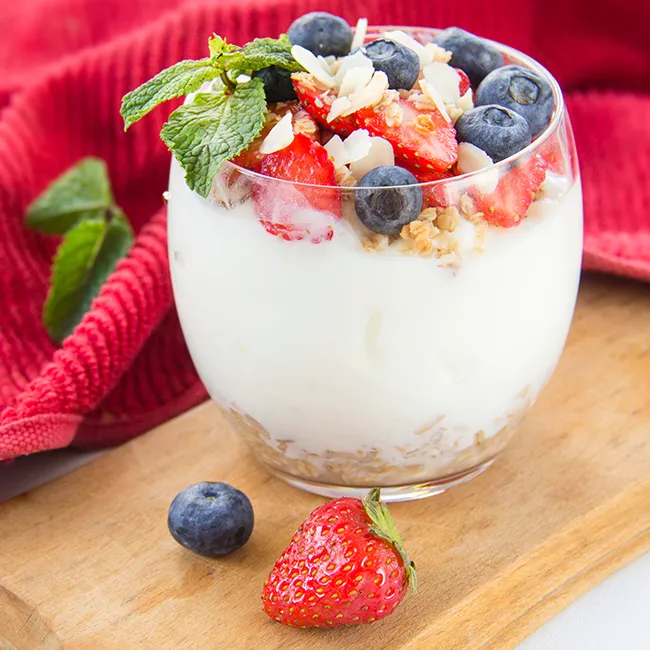 "Healthy parfait with blueberries, strawberries, and walnuts"