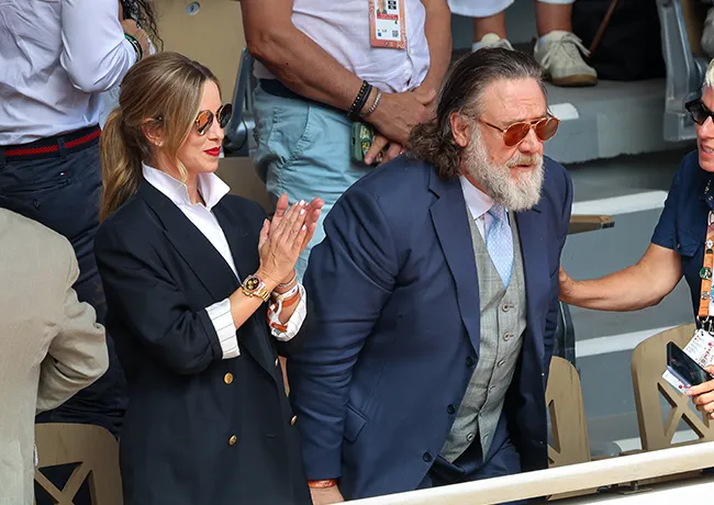 Russell Crowe and Britney Theriot at a public event.