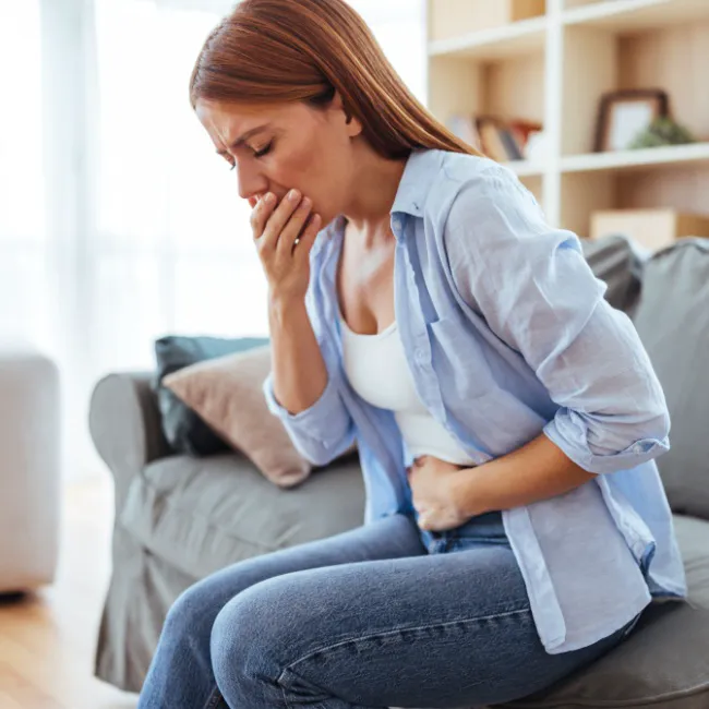 "Woman experiencing stomach pain"