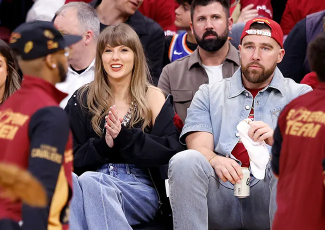 "Taylor Swift watching Travis Kelce chug a beer at the Knicks vs. Cavaliers game"