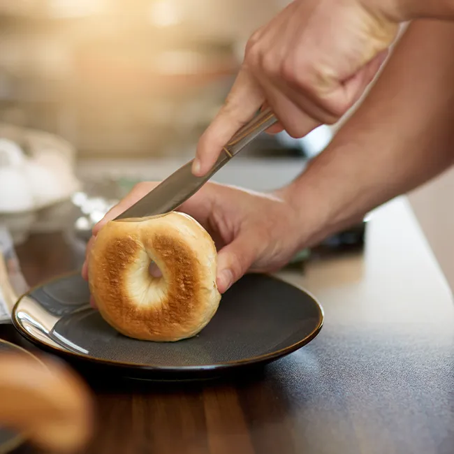 "Cutting into a bagel"