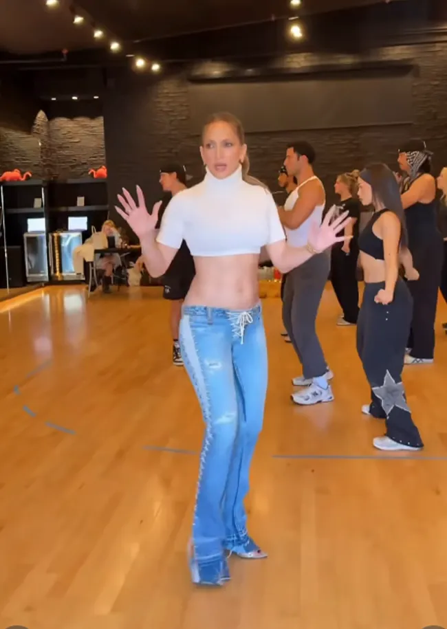 "Jennifer Lopez dancing in jeans from 25 years ago"