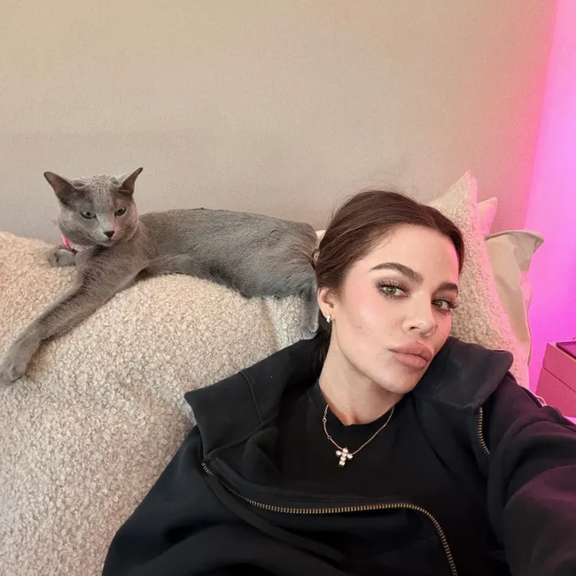 "Khloé Kardashian with her cat in an Instagram selfie"
