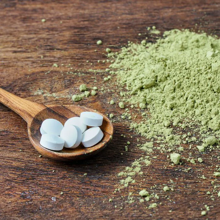 "L-theanine supplements in a white container"