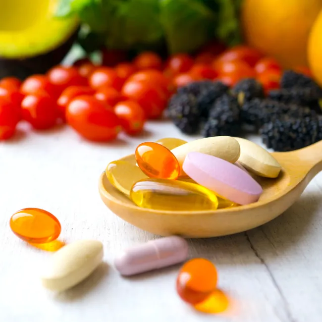 "Multivitamin bottle with assorted pills"