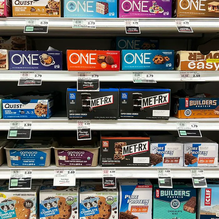 "Different protein energy bars on store shelves"