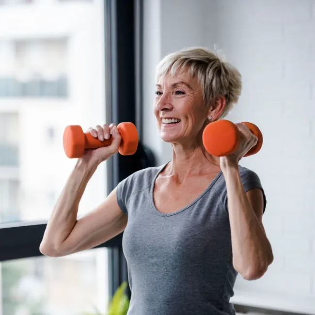 "Woman lifting weights in a gym"